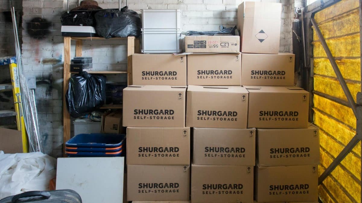 A stack of storage boxes in a well-organized warehouse interior.
