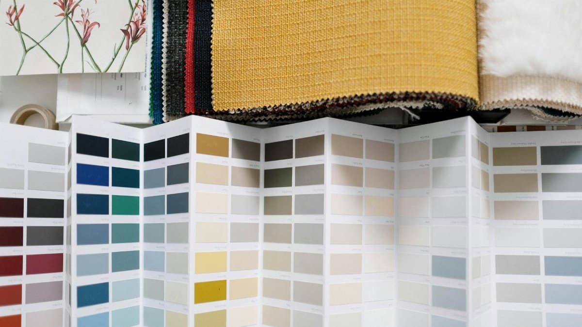 A variety of fabric swatches alongside a detailed color palette for design inspiration.