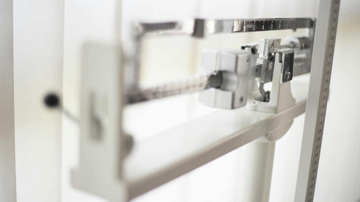 Detailed view of a classic mechanical balance scale, offering precision in weight measurement.