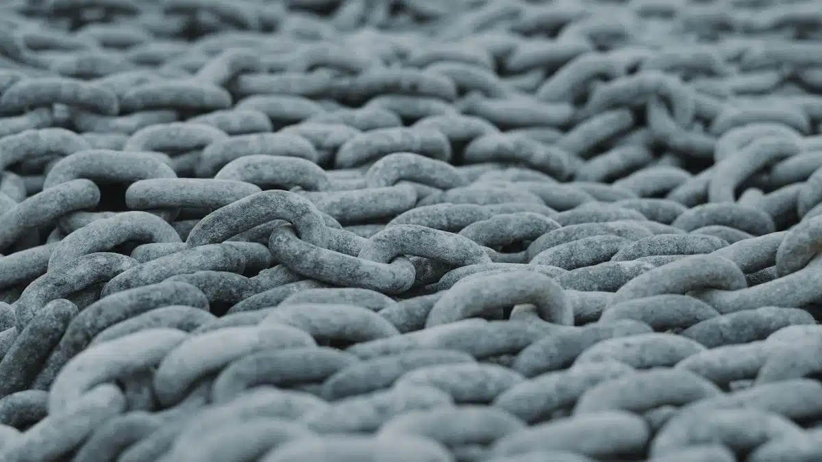 Detailed view of intertwined steel chains creating a rugged texture.