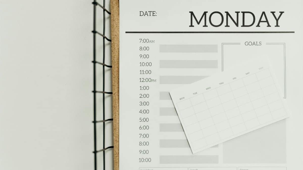 Top view of a minimalist schedule planner with Monday header. Perfect for organizing daily tasks with goals section.