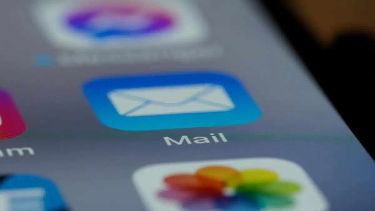 Detailed close-up of an email app icon on a smartphone screen, showcasing modern technology.