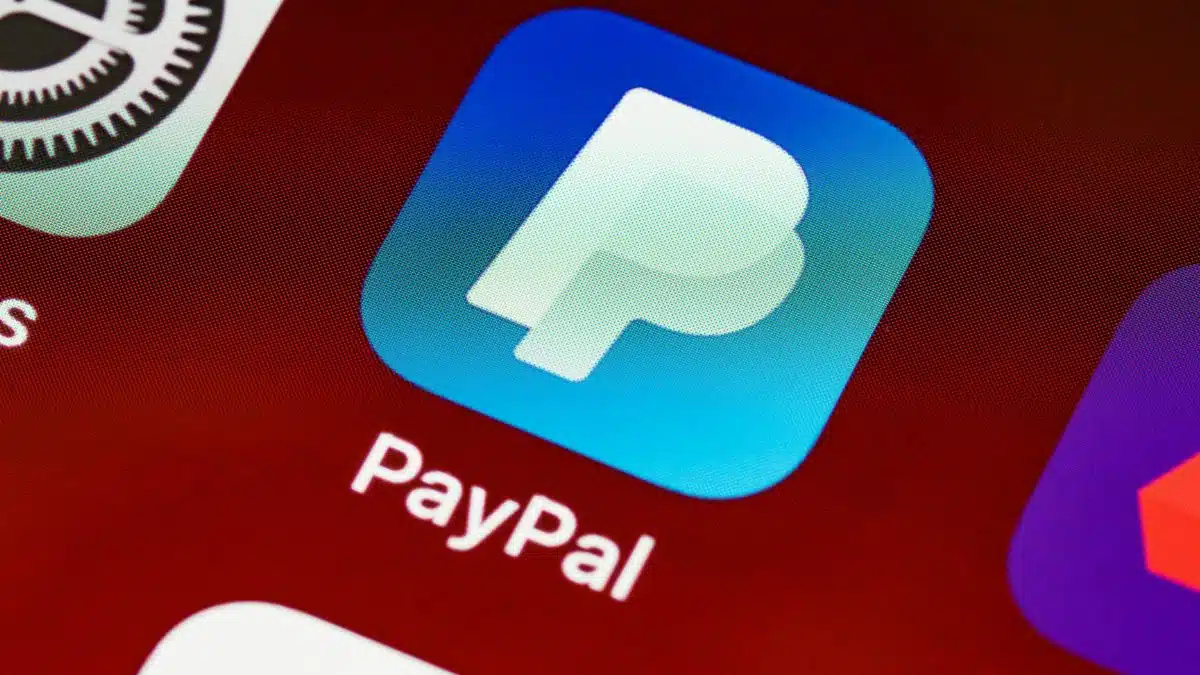Detailed view of PayPal app icon on a smartphone screen highlighting mobile payment technology.