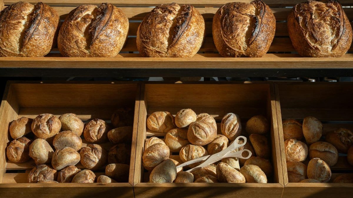 Freshly baked artisan breads displayed in a Berlin bakery, emphasizing variety and craftsmanship.