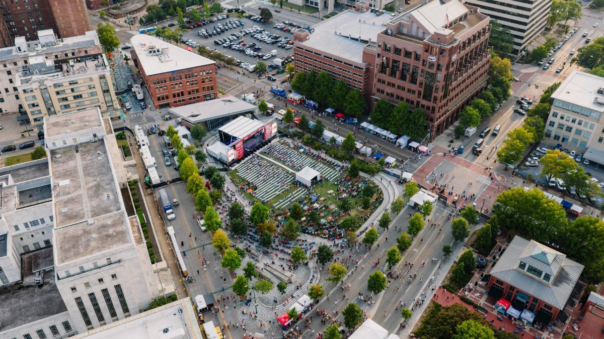 A vibrant aerial shot of an outdoor event in Chattanooga, Tennessee, showcasing crowds and city architecture.